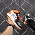 Rear-side view showing printed quotation-style text on the upper and an orange outsole.