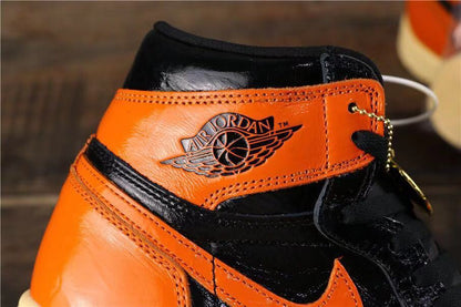 Close-up of the orange collar panel, black trim, stitching, and Air Jordan wing branding.