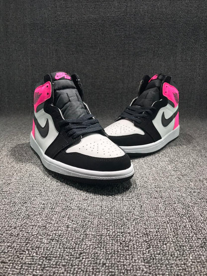Front three-quarter view of the pair with white perforated toe boxes, black overlays and laces, and pink collar accents.