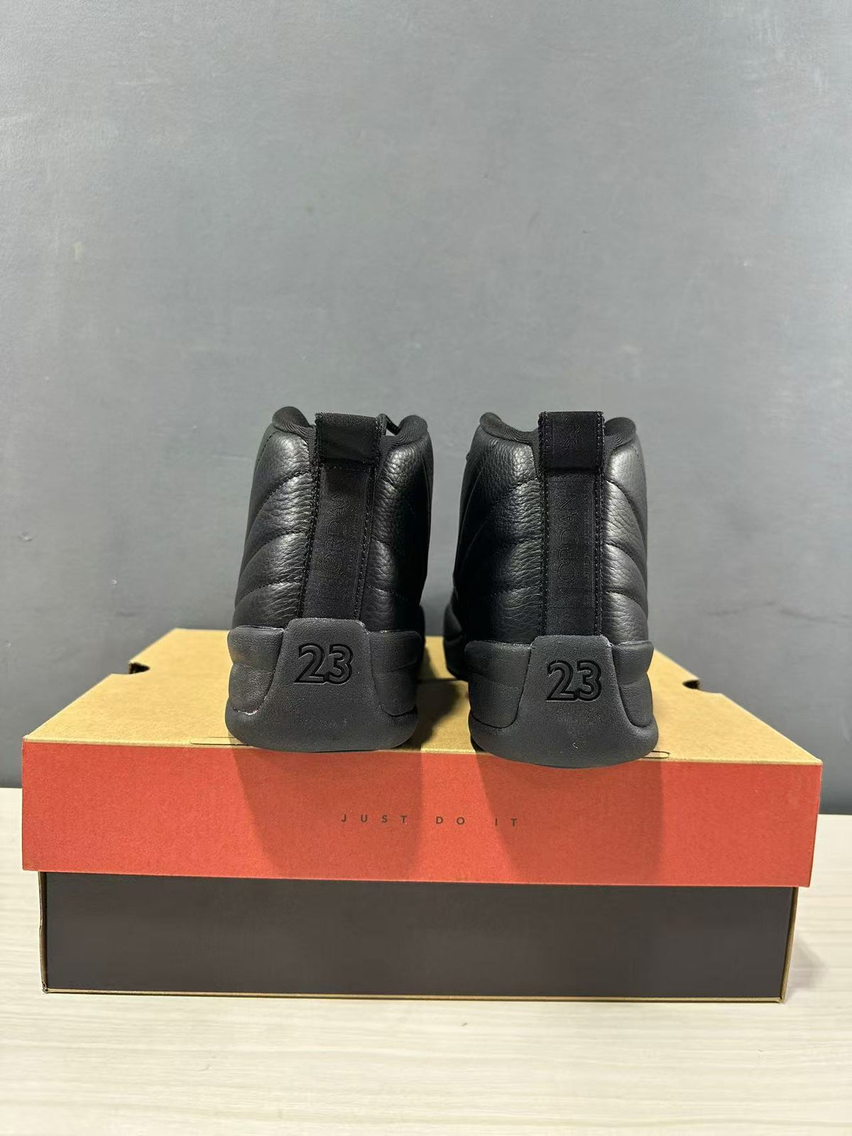 Rear view of the pair showing heel pull tabs and raised 23 detailing.
