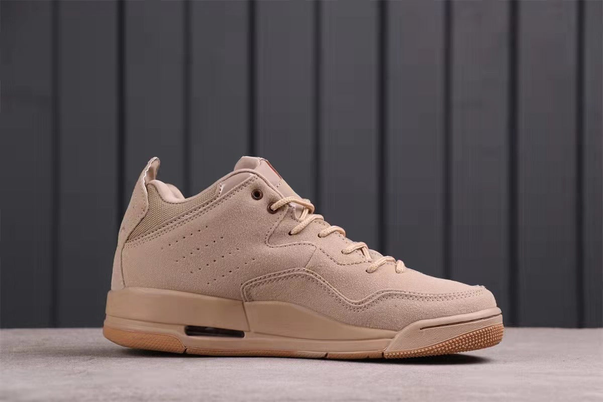 Side profile of one sneaker showing the low-top shape, perforated panel, and lace-up closure.