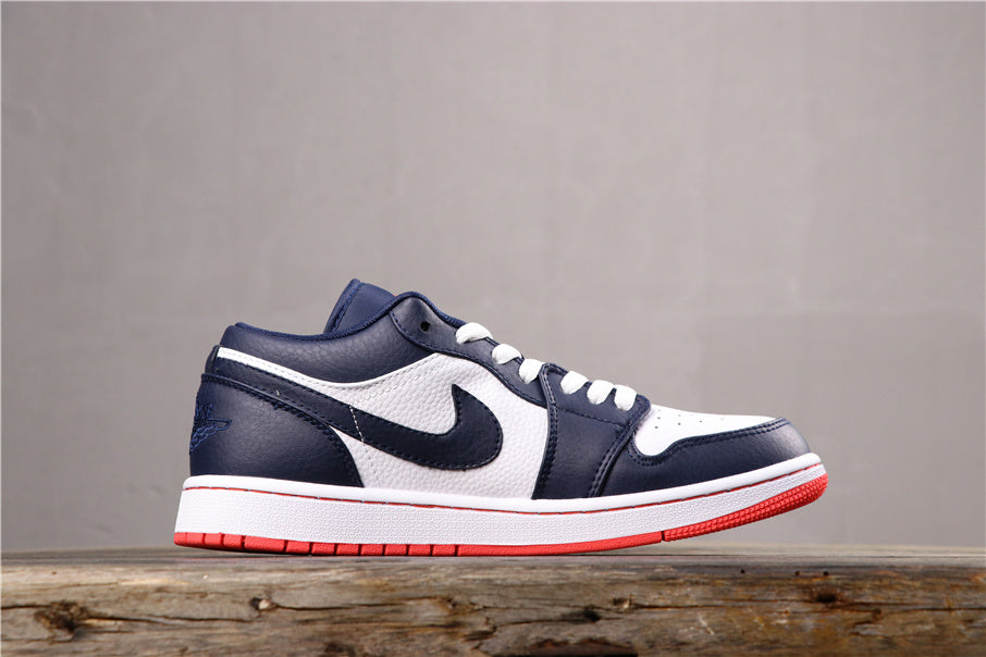 Side profile of the low-top sneaker showing the dark blue Swoosh, white side panel, and red outsole.