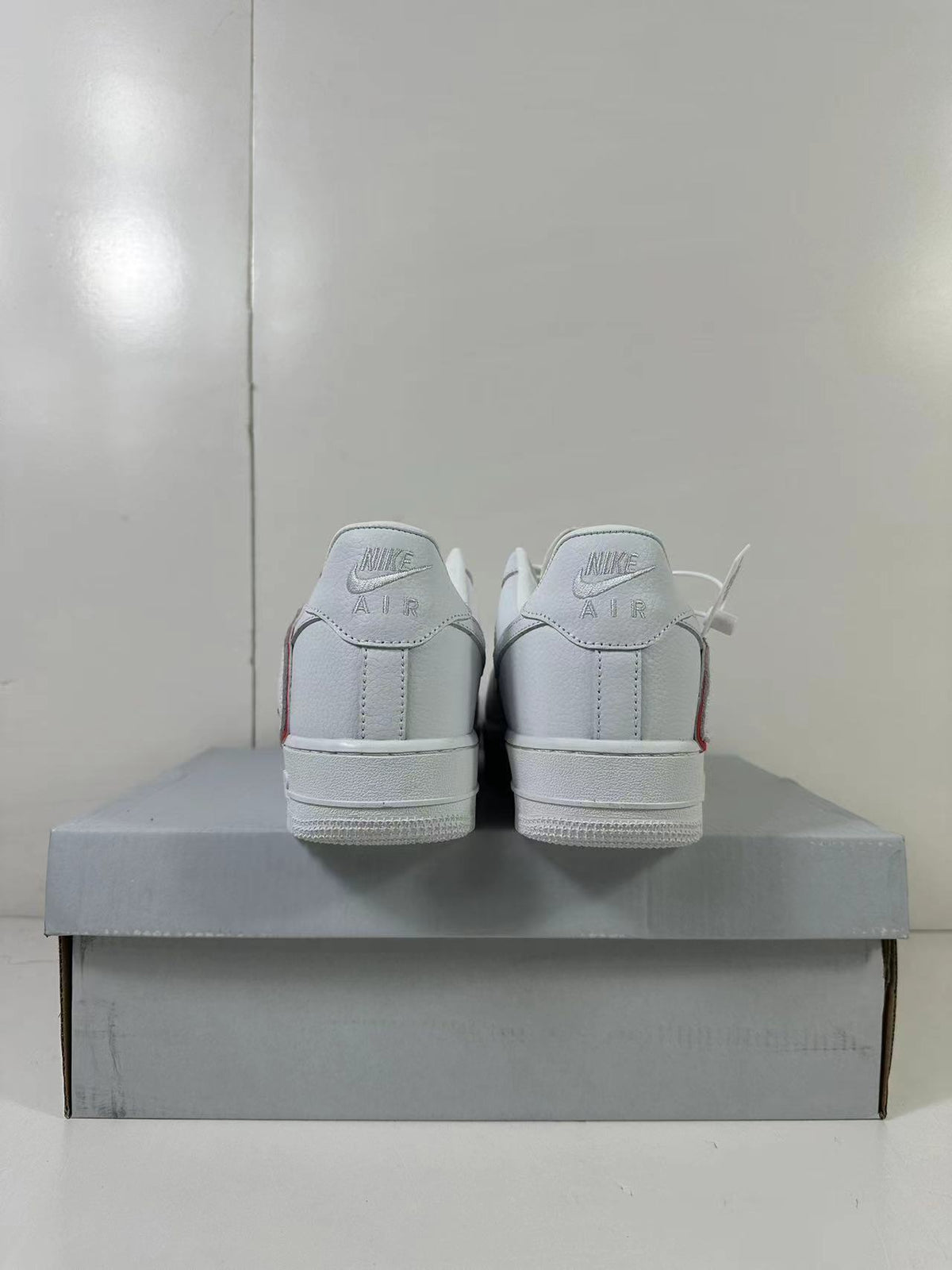 Rear view showing Nike Air branding on the white heel tabs and the textured outsole edges.