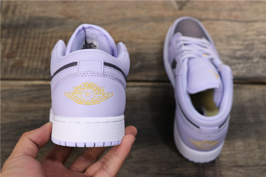 Rear view showing the embroidered Jordan Wings design, dark heel trim, and white rubber midsoles.