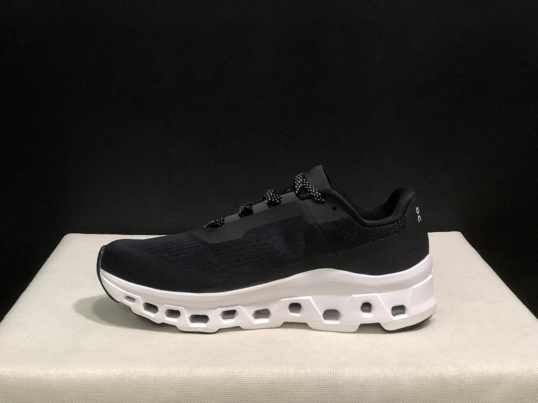 On Cloudmonster Black and White Running Sneakers