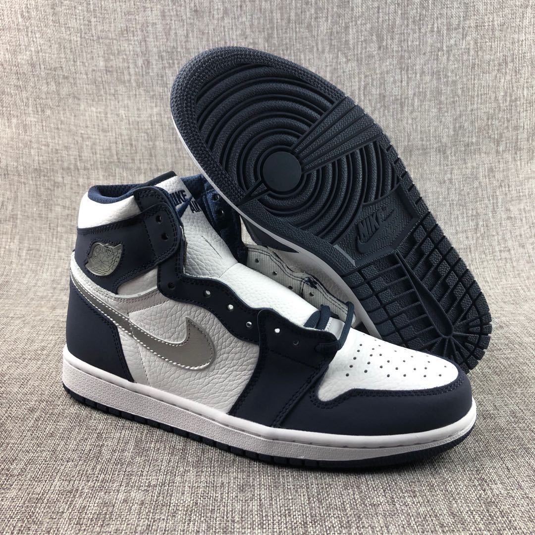 Sneakers shown from the side and outsole, displaying the dark patterned rubber tread.