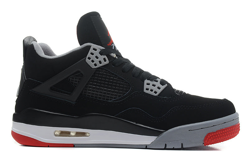 Side profile showing the black upper, grey lace supports, mesh panel and red outsole.