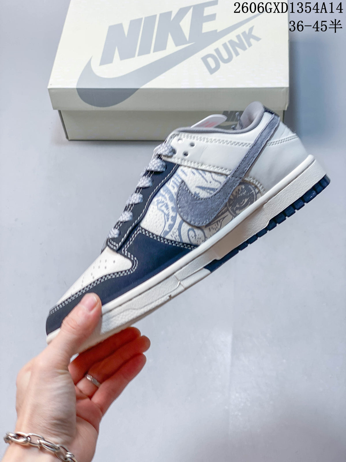 Nike Dunk Low x Undefeated Sneakers in White and Navy