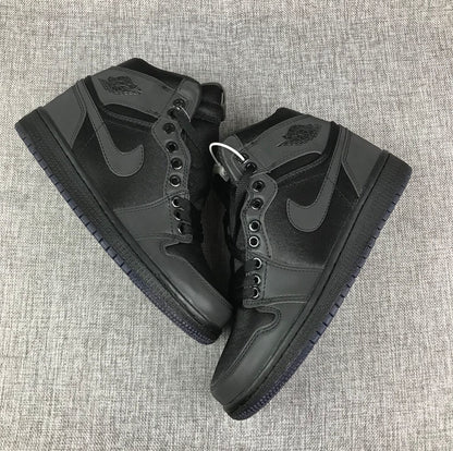 Top-down view of the pair showing the black high-top construction, laces, and tonal overlays.