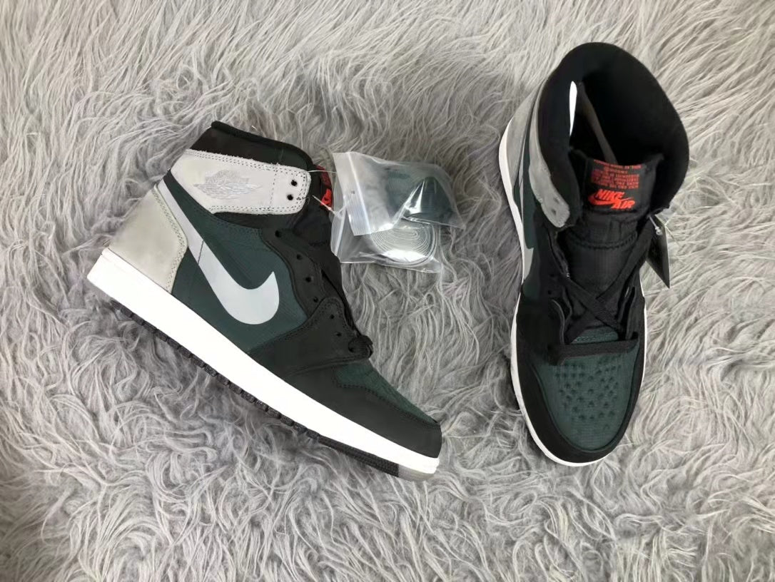 Top-down view of the pair showing the high-top construction, dark green toe panels, grey overlays and white midsoles.