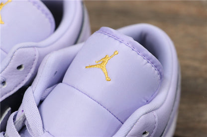Close-up of the light purple padded tongue with embroidered gold Jordan branding.