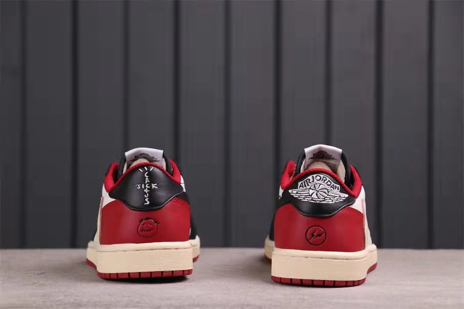 Rear view showing red heel panels, black heel tabs, and branded heel graphics.