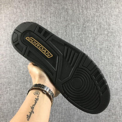 Black outsole with Jordan branding in a gold-colored inset