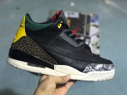 Angled side view showing the black upper, patterned heel panel, green collar, yellow heel accent, and light midsole.