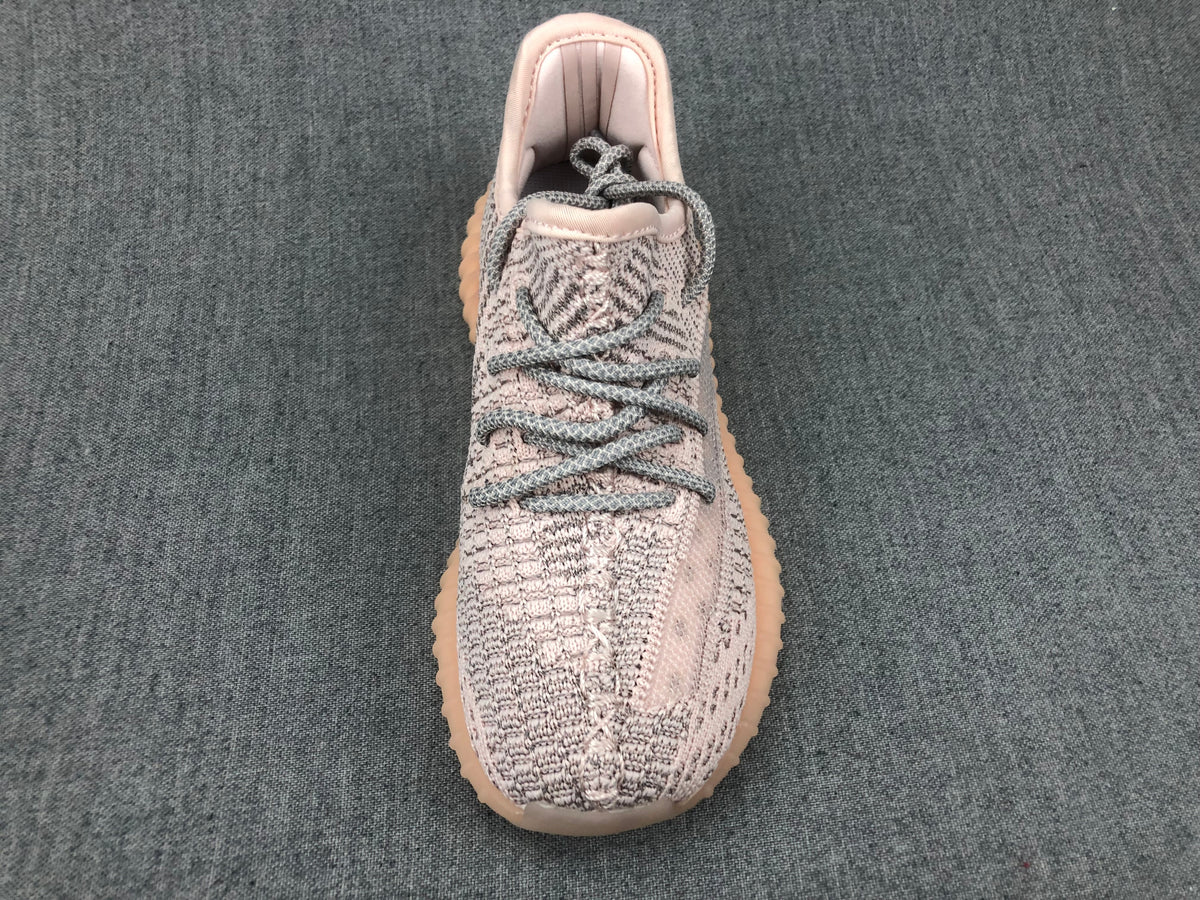 Top-down view showing the knit-style toe box, gray laces, and padded collar.