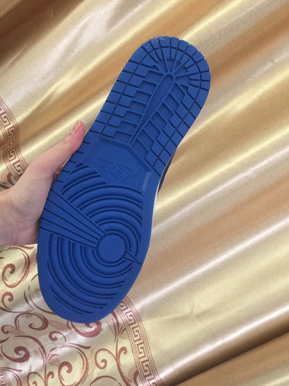Close-up of the blue rubber outsole showing its circular and segmented tread pattern.