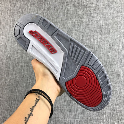 Underside view showing the grey outsole and red traction area