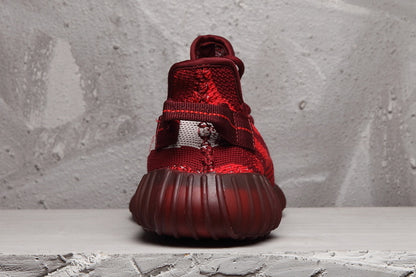 Rear view showing the heel pull tab and ribbed dark red sole.