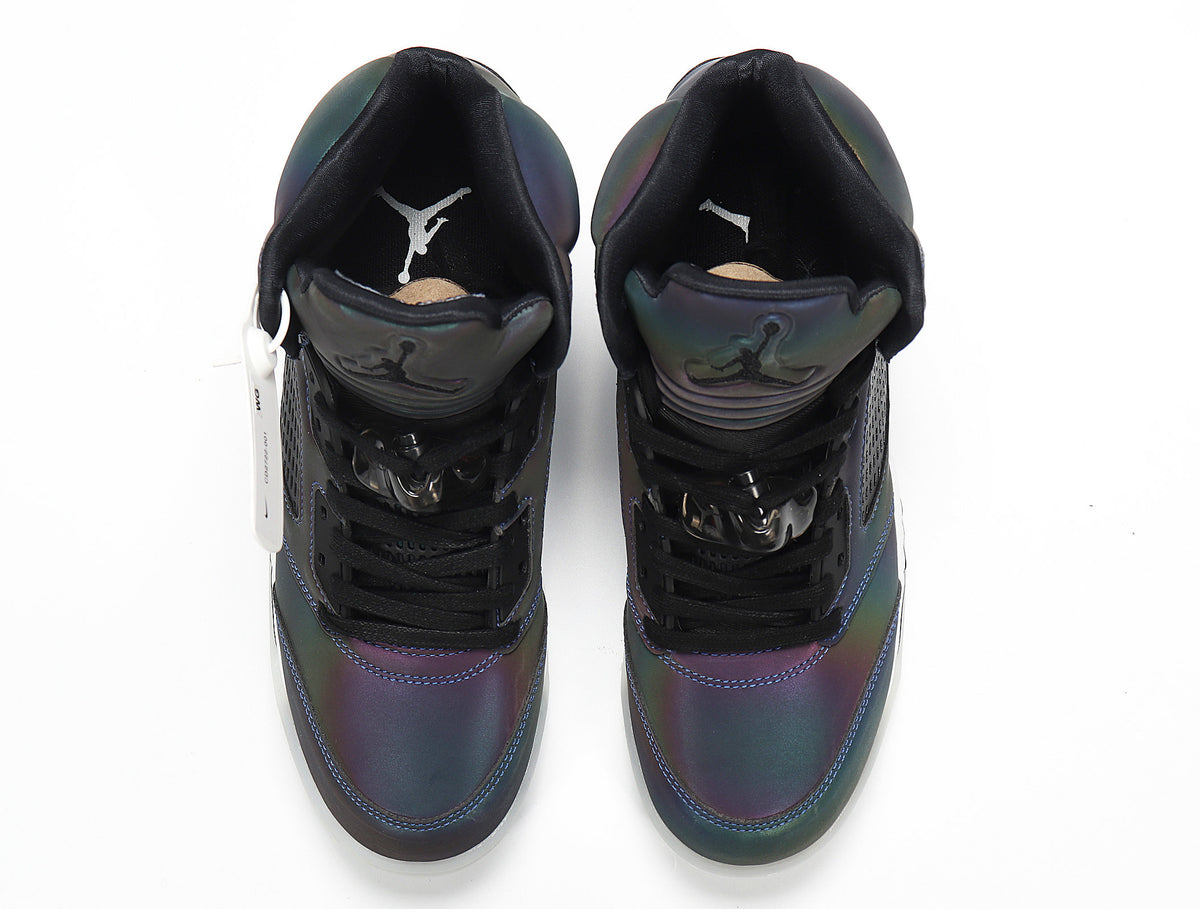 Top view of the black and iridescent high-top sneakers.