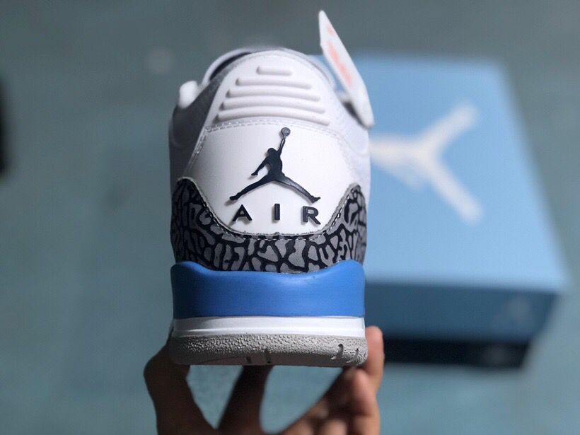 Rear view of a Jordan 3 Retro sneaker with blue heel detail