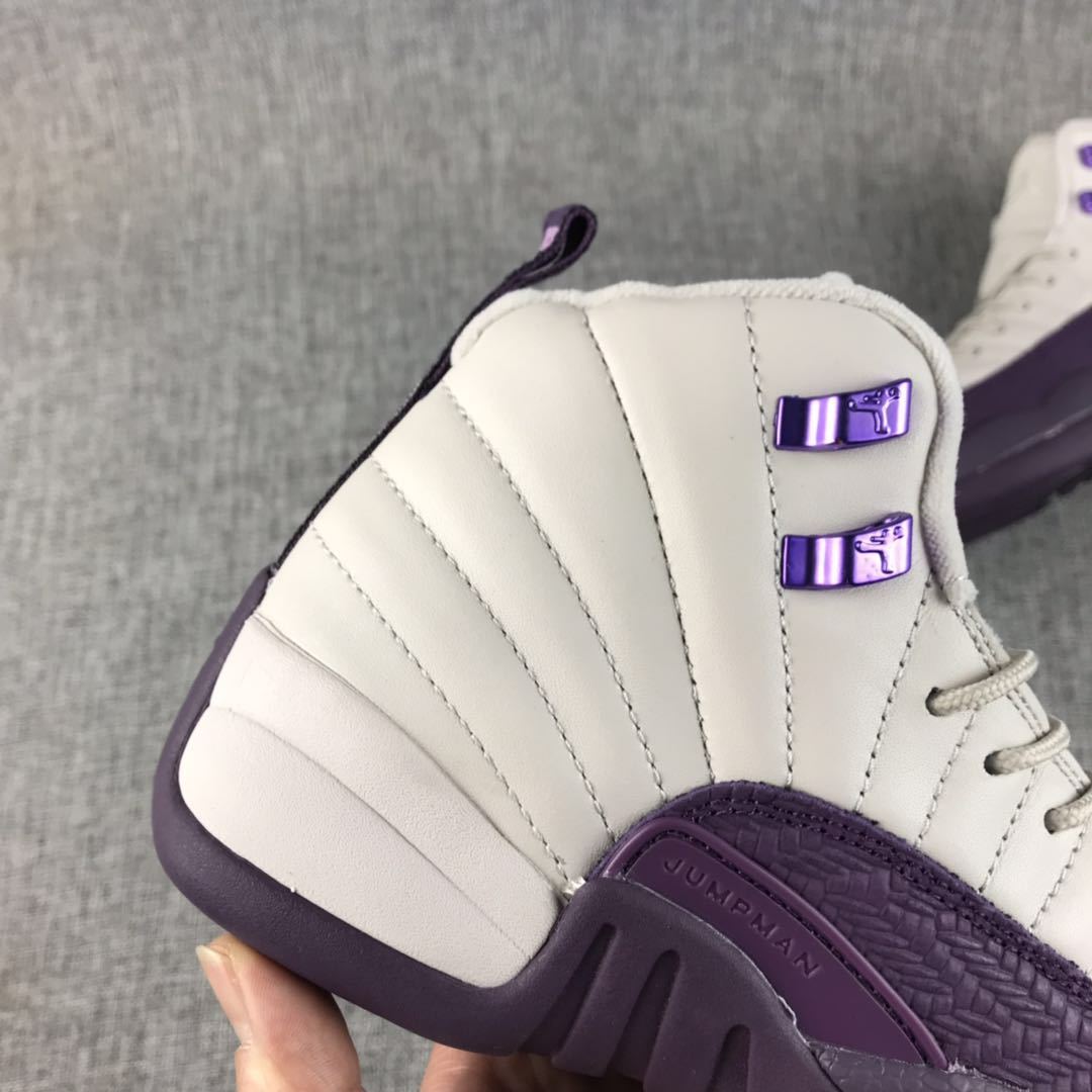 Close-up of the stitched off-white heel panel and purple lace hardware