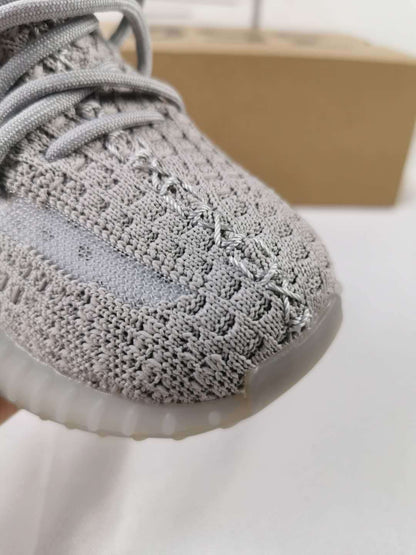 Close-up of the gray textured upper and front stitching detail.