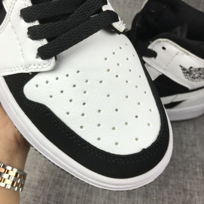 Close-up of the perforated white toe box and black lace area.