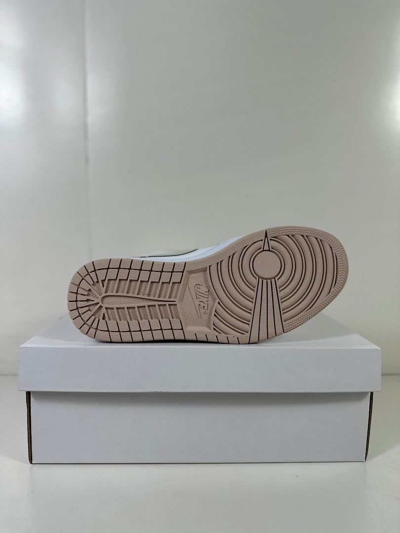 Underside view showing the light bone rubber outsole with circular traction details.