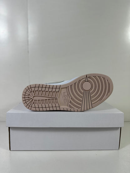 Underside view showing the light bone rubber outsole with circular traction details.