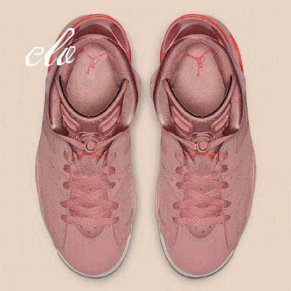 Top-down view of the pair showing the laces, padded tongues, and pink upper.