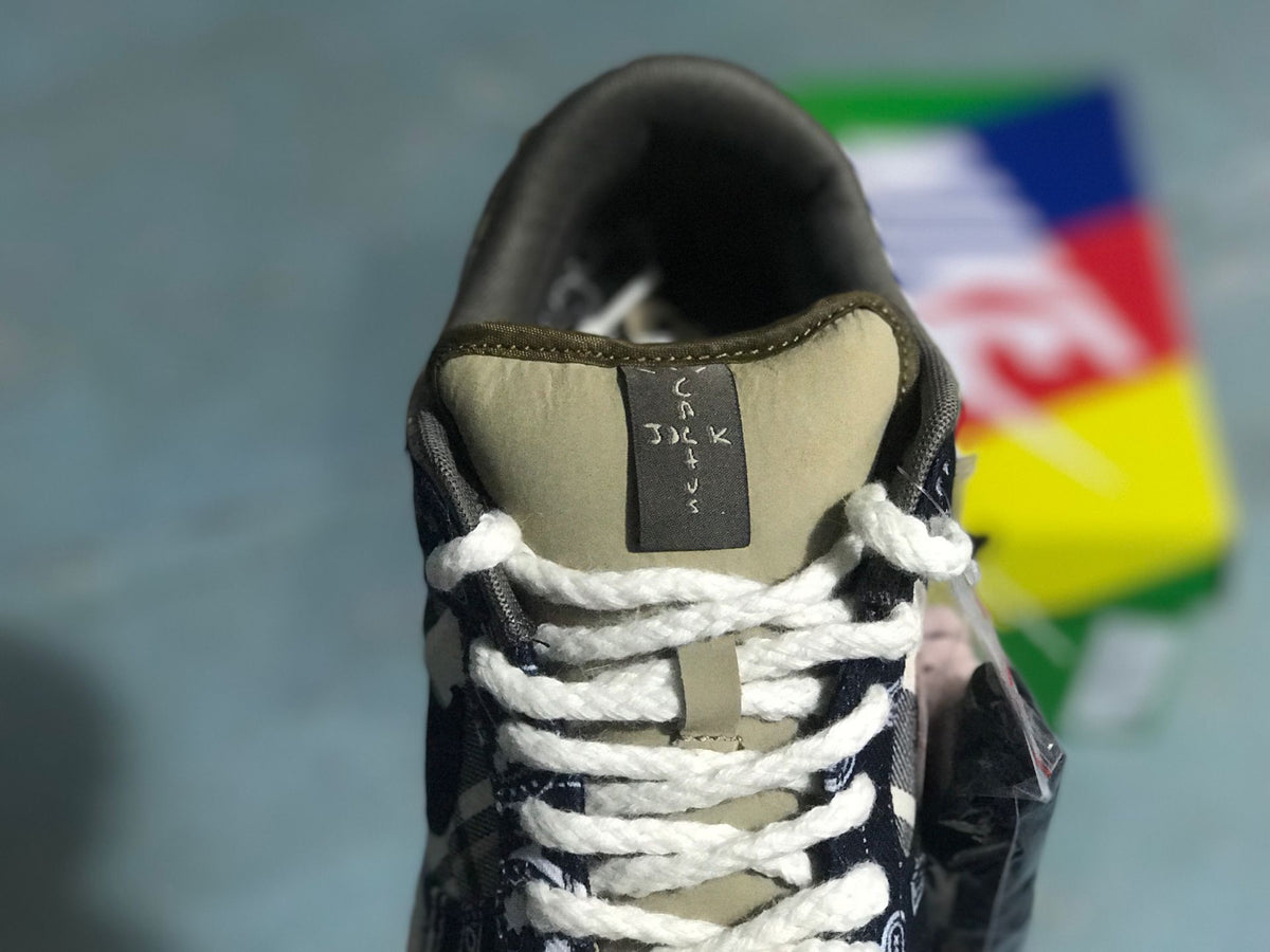 Front view showing the padded tongue, white laces, and patterned toe and vamp panels.