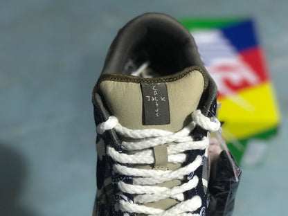 Front view showing the padded tongue, white laces, and patterned toe and vamp panels.