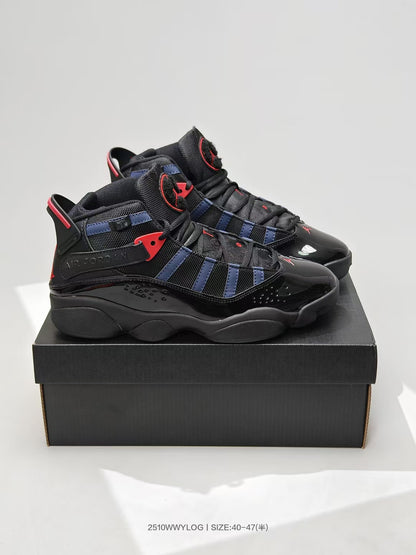 Pair of black, navy, and red high-top sneakers displayed on a black shoebox.