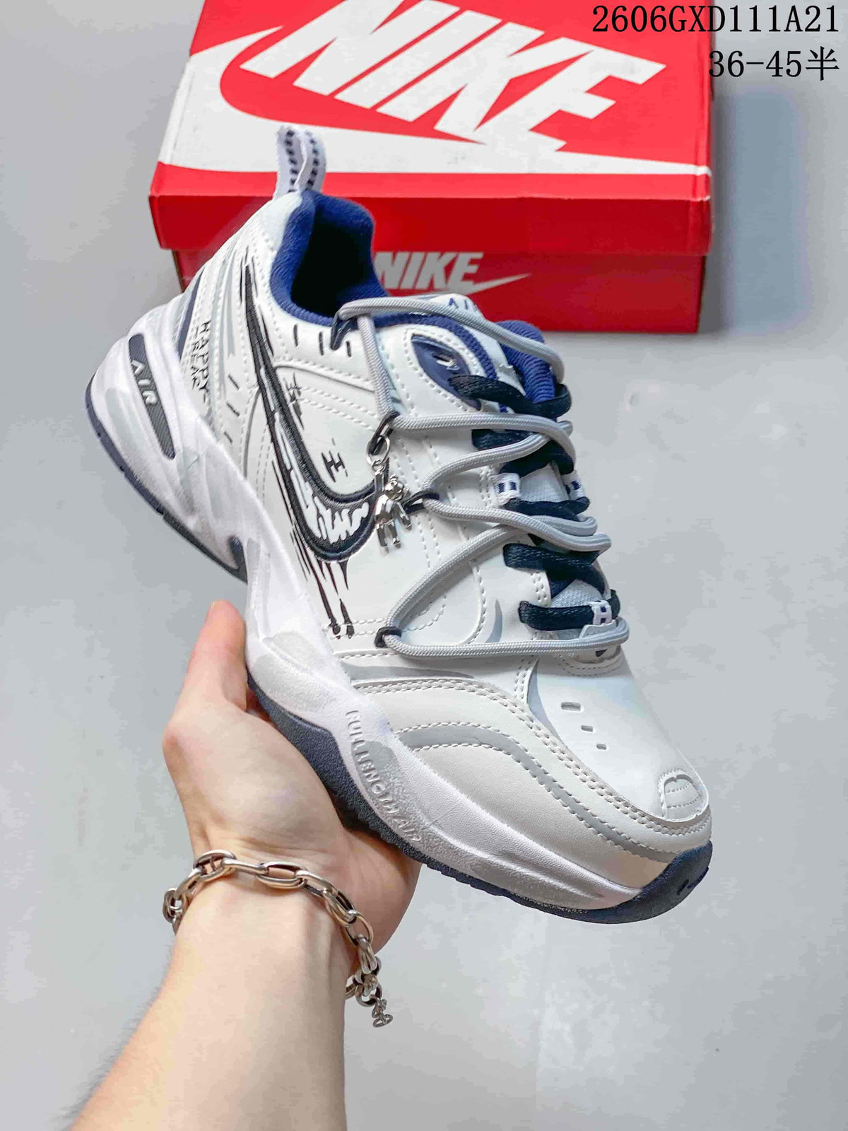 Nike Air Monarch IV White and Blue Low-Top Sneakers