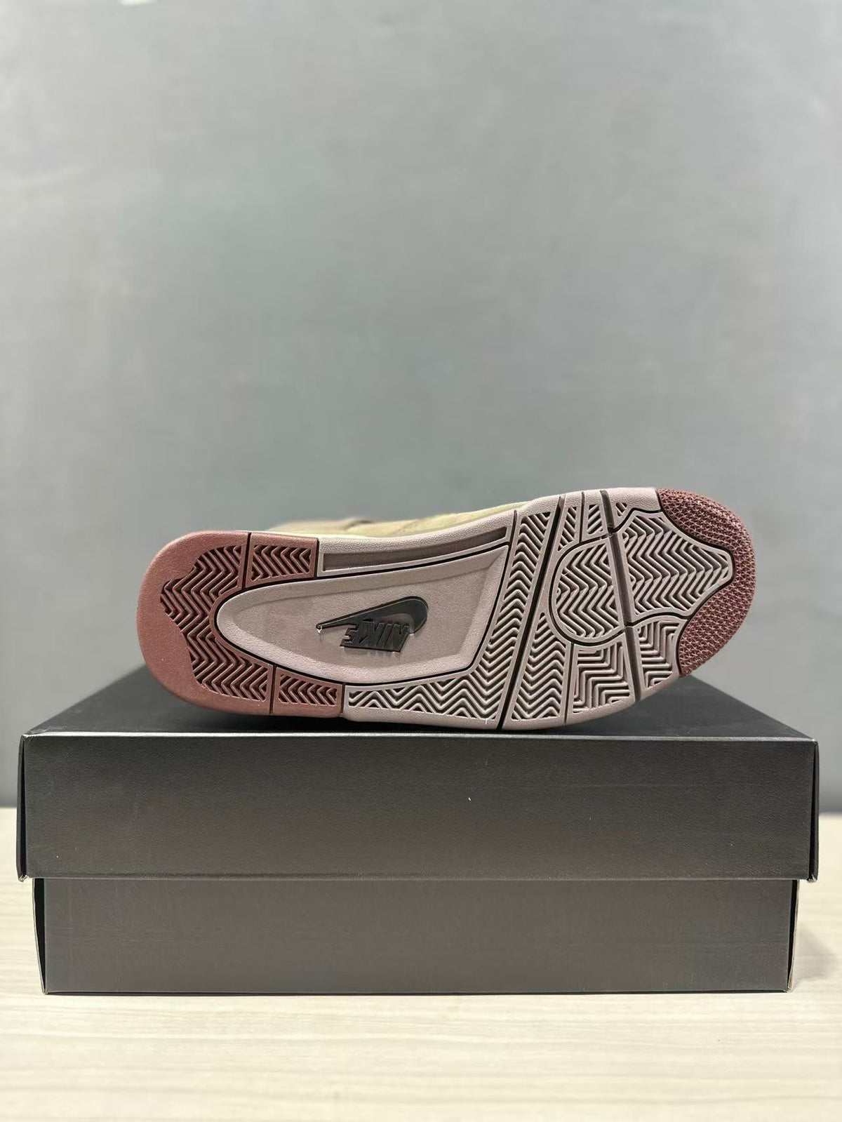 Outsole close-up showing the patterned traction design and visible Nike branding.