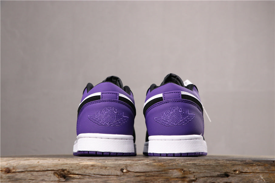 Rear-facing view of the pair showing matching purple heel panels and embossed logos.