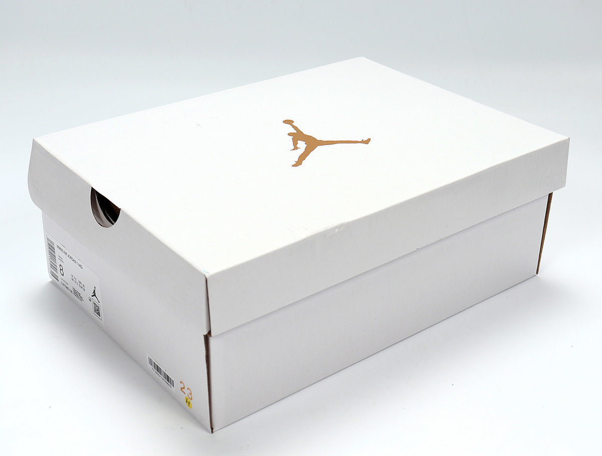 White Jordan shoebox with a gold Jumpman logo and a visible size label.