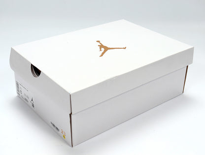 White Jordan shoebox with a gold Jumpman logo and a visible size label.