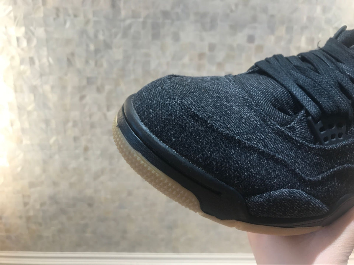 Close-up of the textured black toe area and translucent gum-colored outsole.