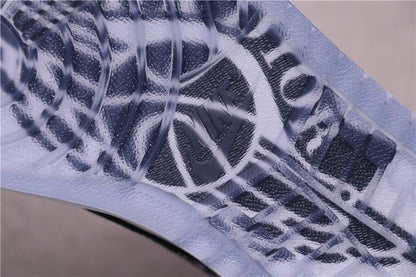 Close-up of the translucent outsole showing a dark printed winged basketball graphic.
