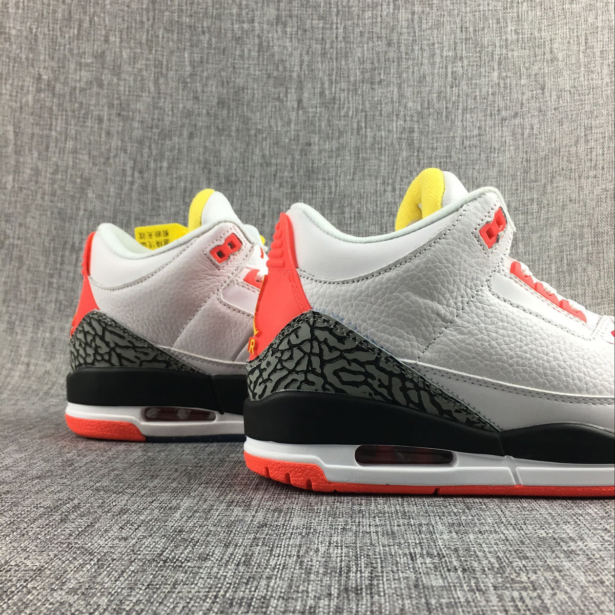 Close-up of the heel and midsole with elephant-print detailing and red accents.