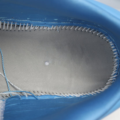 Close-up of the blue sneaker interior showing the lining and stitching.