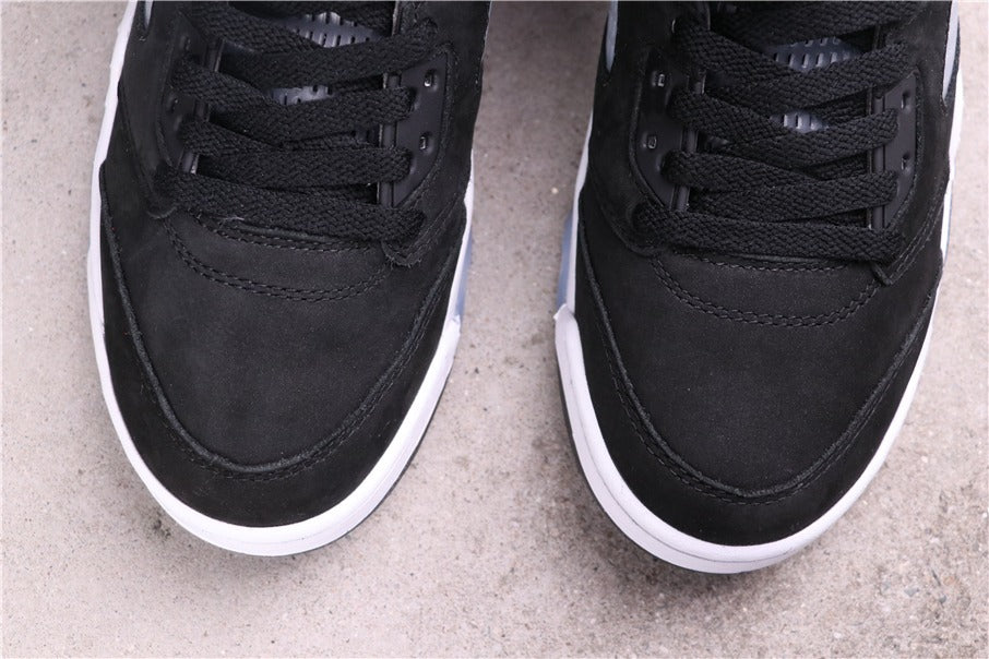 Close-up of the black laces, eyelets, stitched toe panel, and white midsole edge.