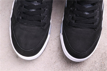 Close-up of the black laces, eyelets, stitched toe panel, and white midsole edge.