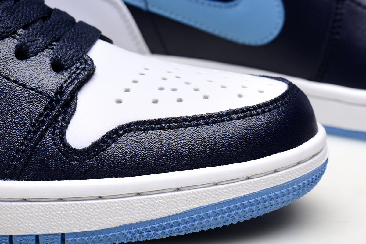 Close-up of the perforated white toe panel and blue outsole
