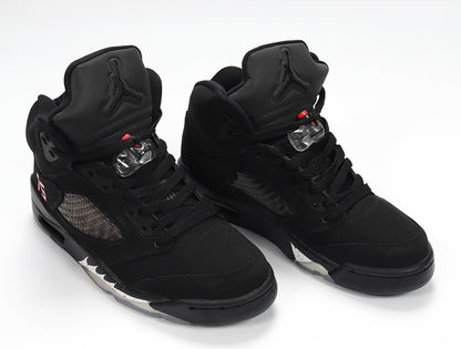 Pair of black Air Jordan 5 sneakers shown from an angled front view