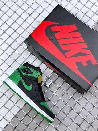 Black and pine green high-top sneaker beside a branded shoebox.