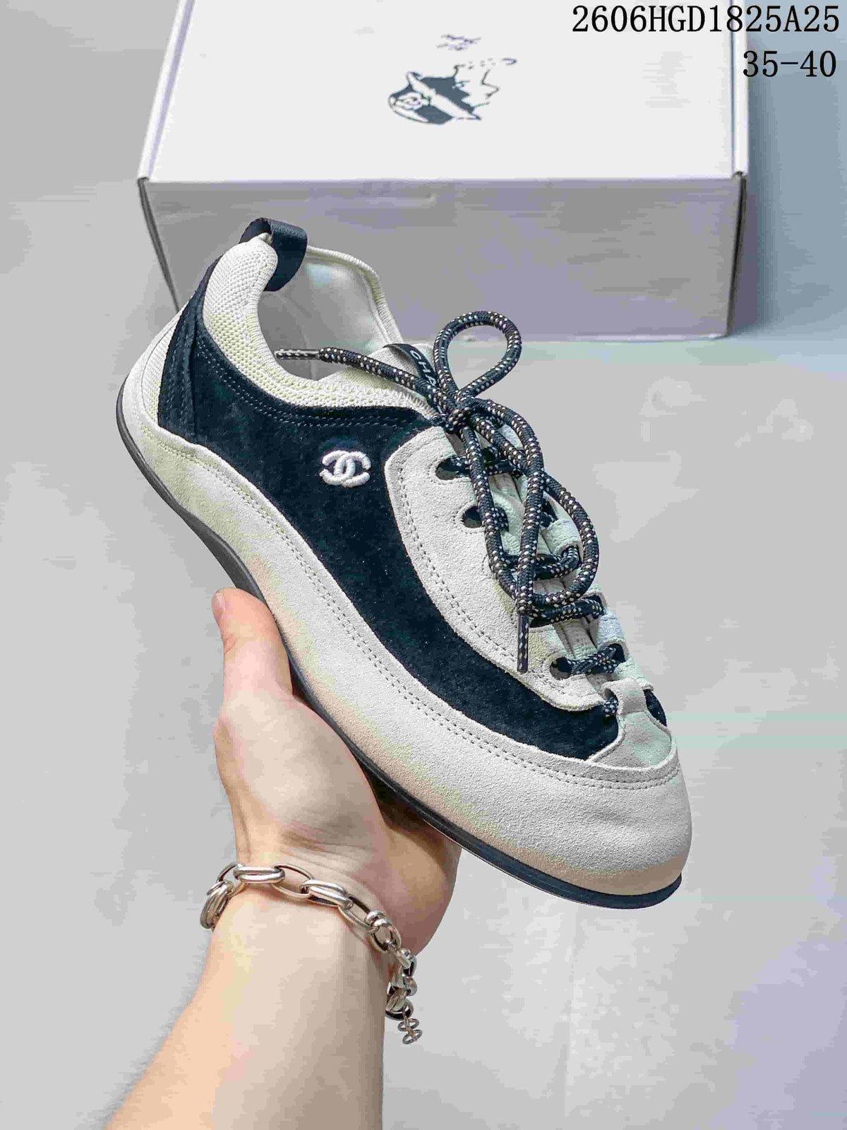 Chanel Two-Tone Low-Top Trainer in Black and Ivory