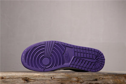 Underside view showing the purple rubber outsole with circular pivot detail and patterned tread.