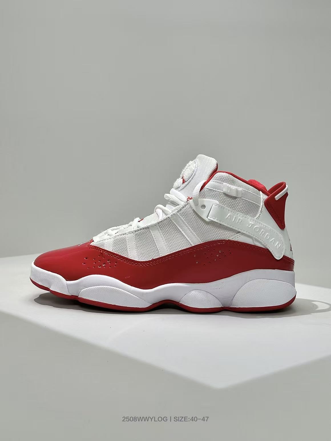 Side profile of one white and red Jordan high-top sneaker with visible AIR JORDAN strap branding.